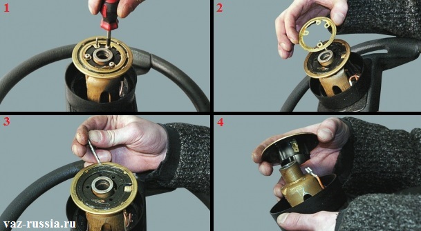 Откручивание винтов крепления контактного кольца и его снятие, а так же вынимание штифта указателя поворота и снятие основания с руля автомобиля